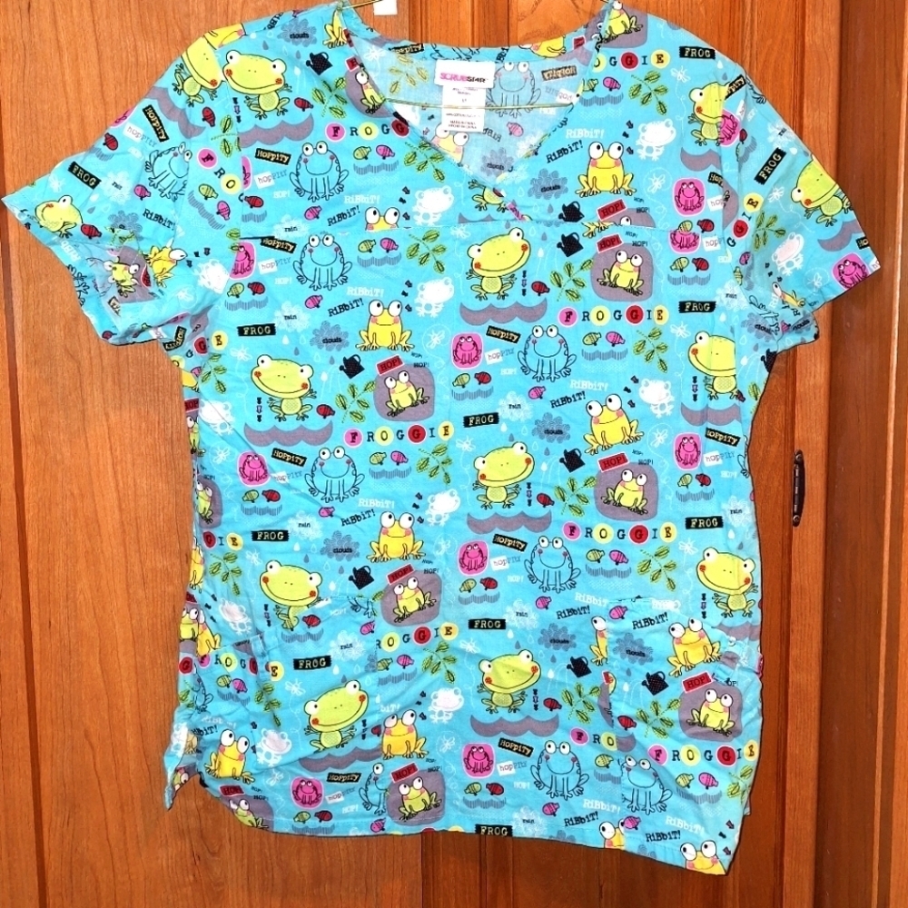 A set of ScrubStar scrubs in a medium.  They feature a frog print all over.